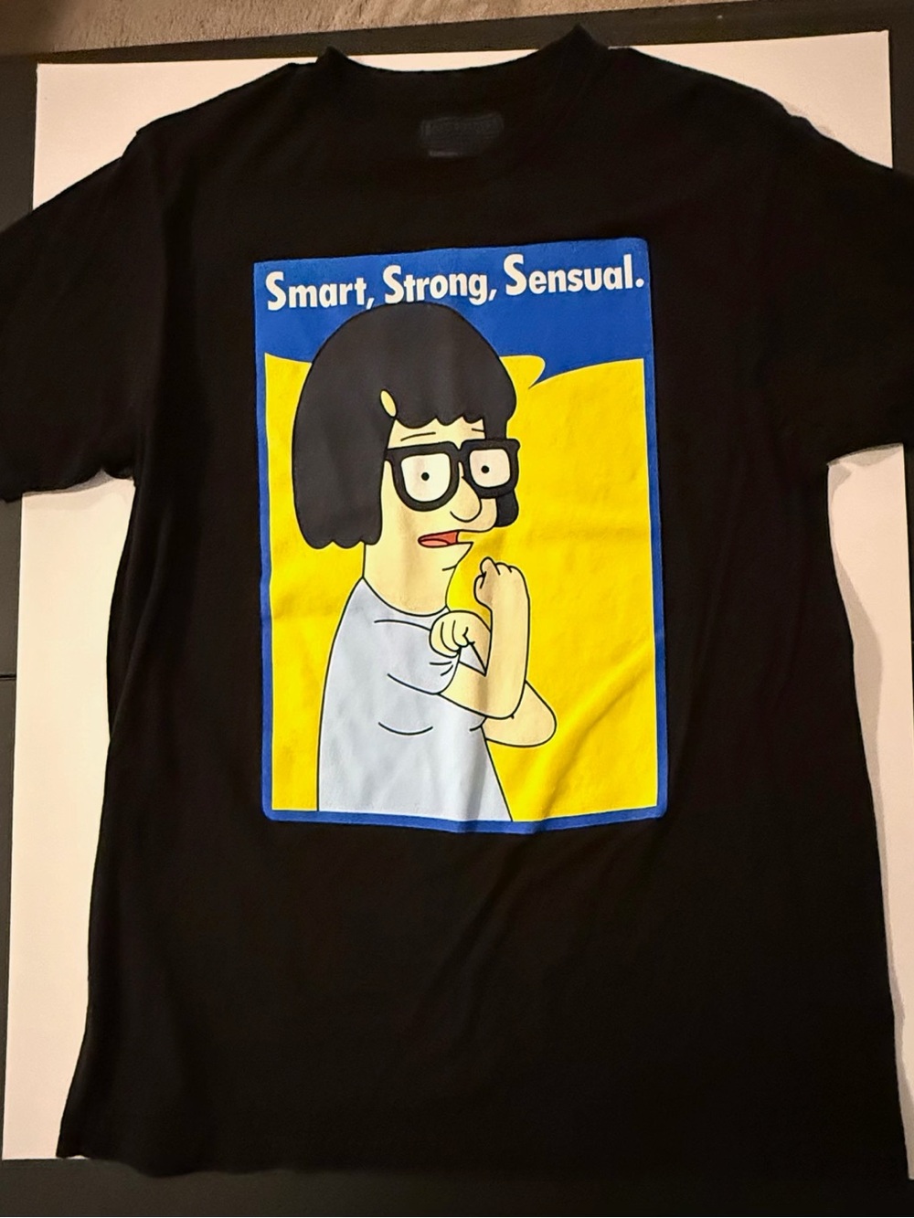 Ripple Junction Black Tee with Yellow & Blue Tina Belcher Graphic